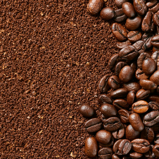 Coffee beans and ground coffee on a brown background