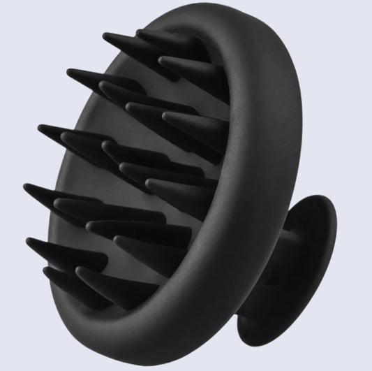 Black scalp massager on a white background