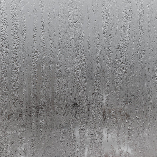 steamed shower glass with water droplets