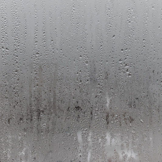 steamed shower glass with water droplets