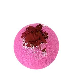 A pink bath bomb with natural rose petals embedded on top, against a white background.