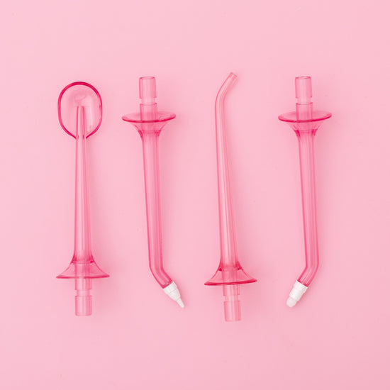 Set of pink silicone straws on a pink background