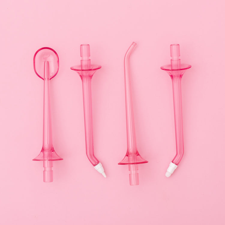Set of pink silicone straws on a pink background