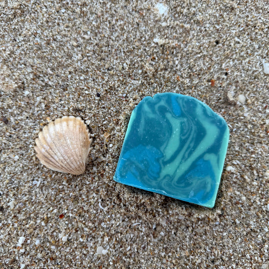 BathBerri Coastal Drift ocean breeze soap bar on sandy beach with seashell — handcrafted natural soap