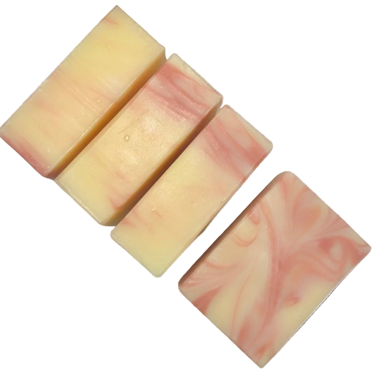 Set of five soap bars with a pink and cream marbled pattern on a white background
