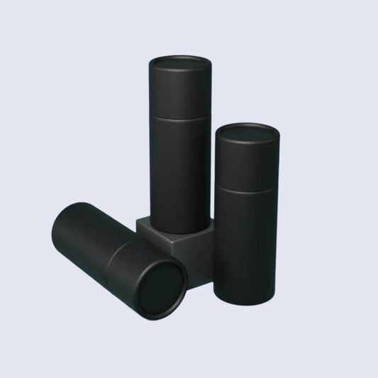 Three black cylindrical push up lip balm tubes on a white background