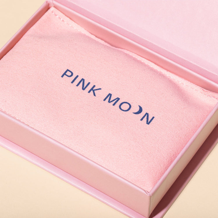 Pink jewelry box with 'PINK MOON' branding on a light pink background