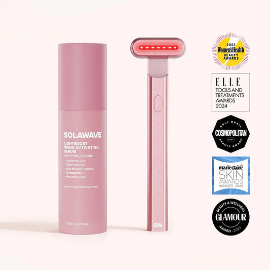 Pink skincare serum bottle and Red light device with awards on a white background