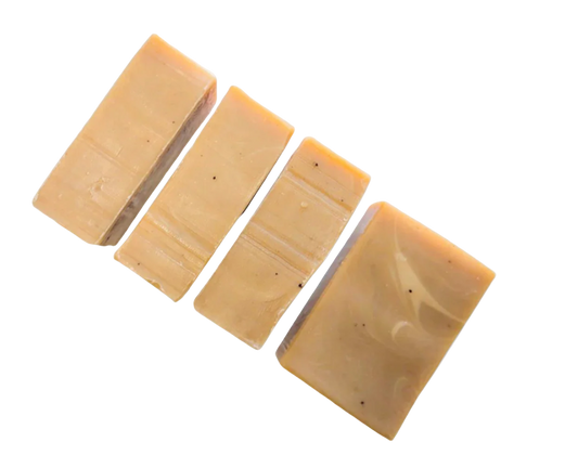 Four rectangular soap bars with a coffee brown and cream marbled pattern on a white background