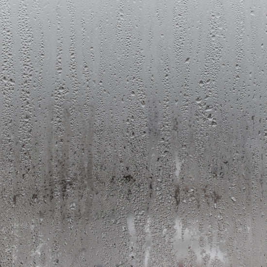 steamed shower glass with water droplets 